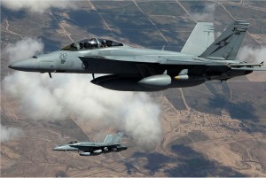 An RAAF F/A-18F Super Hornet F/A-18A Hornet in the skies over Iraq. Photo: Department of Defence